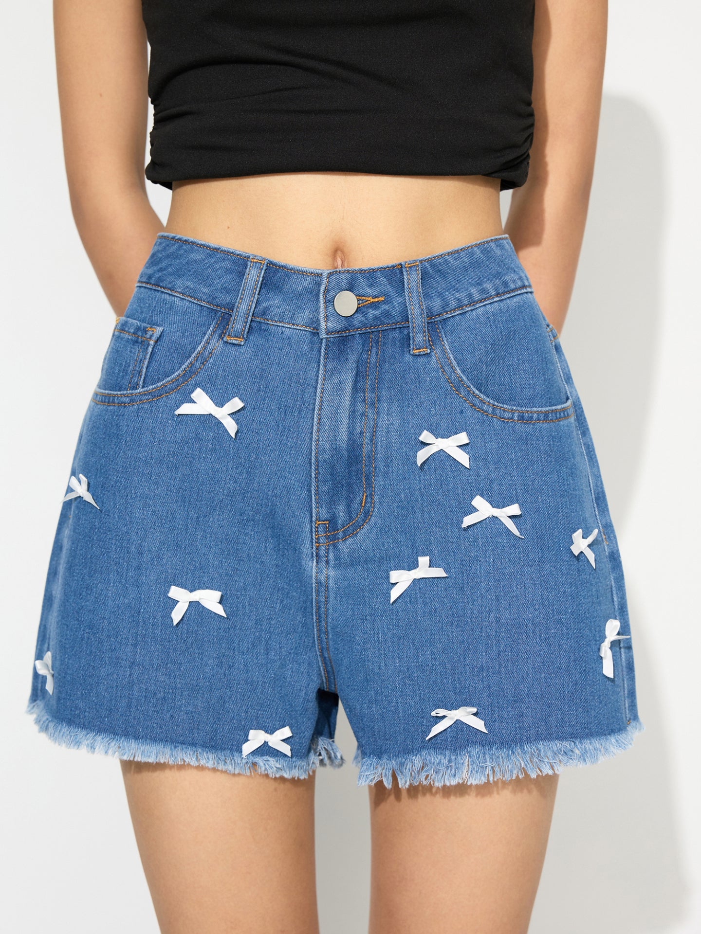 Shorts vaqueros con pernera ancha y lazo